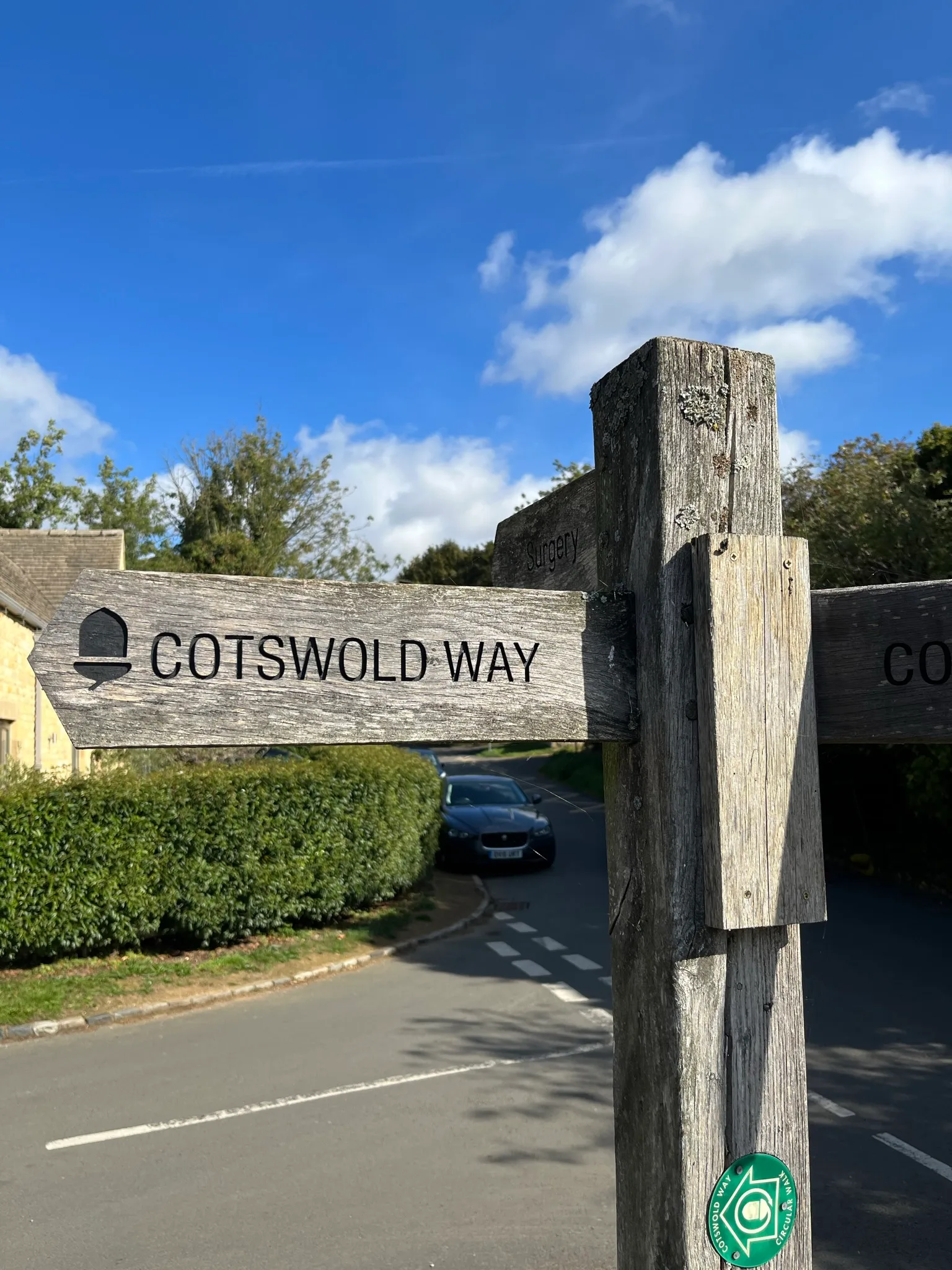 A kissing gate between green fields