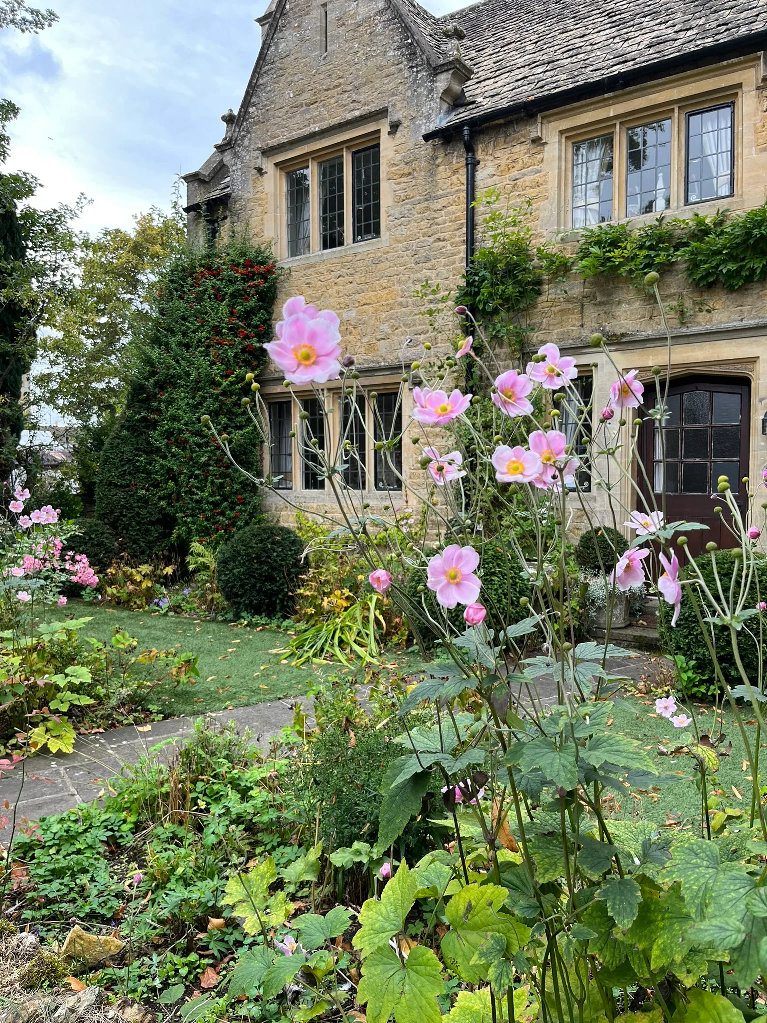 A farmhouse kitchen table set for dinner